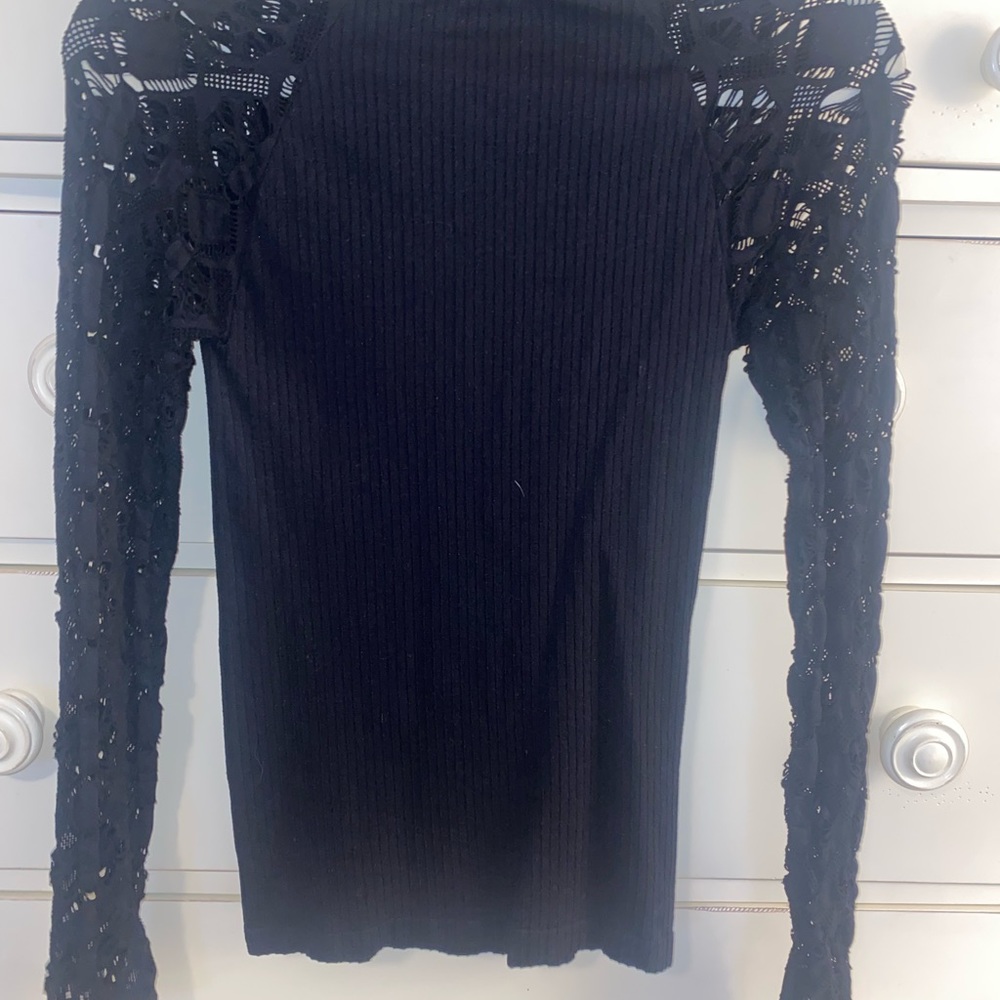 Venus black top with beautiful sleeves and half turtleneck. Sz Small.
